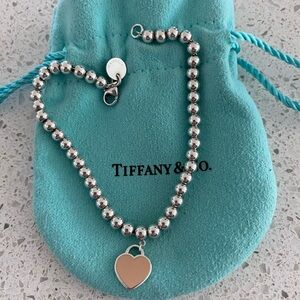 Return To Tiffany heart tag bracelet in pale pink.